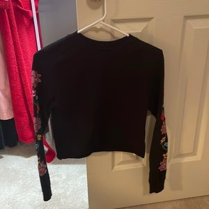 Vans, cropped, long sleeve tee. No pilling, no holes, thick tee shirt material.